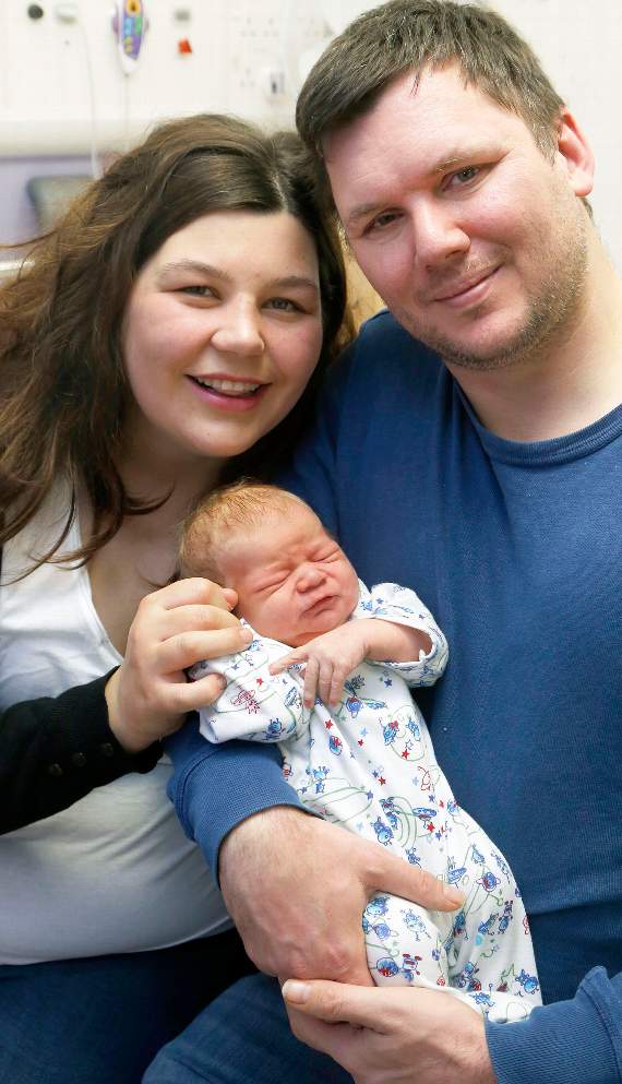 Sam David Palmer-Jones is held by proud parents Catrin Davies and Luke Palmer-Jones after being born at 8.27pm. 18DPJ04JAN67