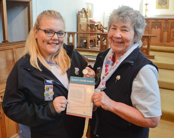 Alicia Walton receives the Queen's Guide Award from Jayne Hancock