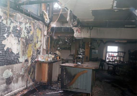 The wrecked bar and restaurant area of Y Ffarmers