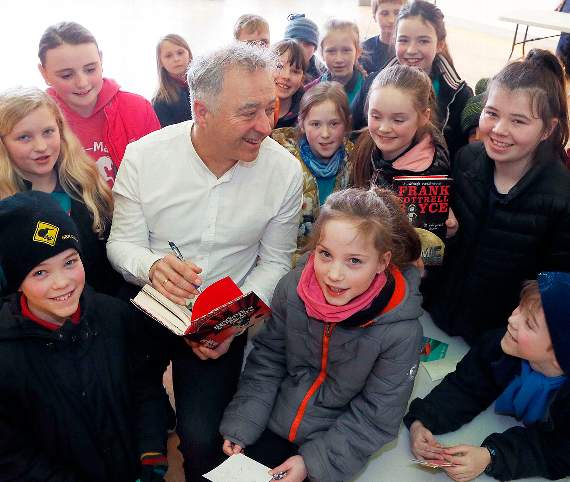 Author Frank Cottrell-Boyce with pupils from Ysgol Rhydypennau, Bow Street. 18DPJ01MAR42