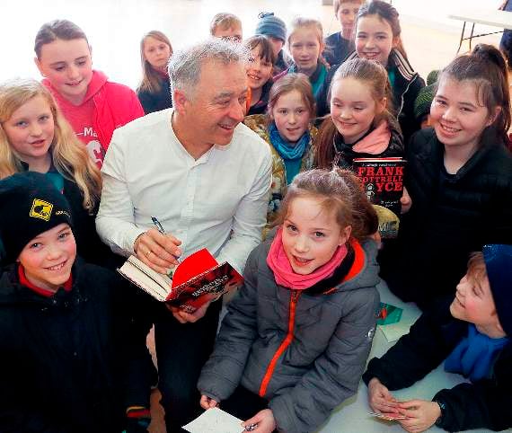 Author Frank Cottrell-Boyce with pupils from Ysgol Rhydypennau, Bow Street. 18DPJ01MAR42
