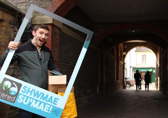 Steffan Rees with the Shwmae Su’mae Day selfie frame at Lampeter Town Hall