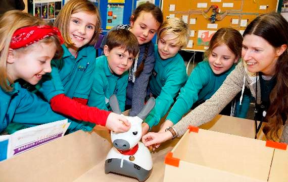 Ysgol Llannon pupils Honey Forbes-Chapman, Natasha Wyley, Dominik Sikova-Wright, Layla Forbes-Chapman, Coby Jones and Seren Evans with Patricia Shaw, computer science lecturer, at the Clwb Robotics Aberystwyth stand