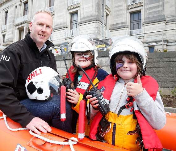 Aberystwyth RNLI helmsman Bryn Harrison with Lyla and Brya Bell