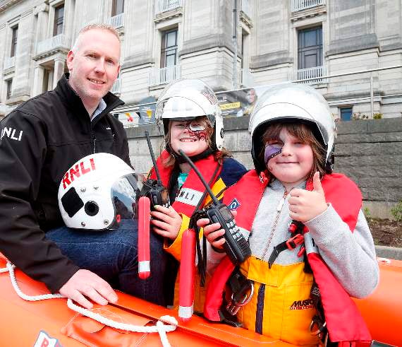 Aberystwyth RNLI helmsman Bryn Harrison with Lyla and Brya Bell