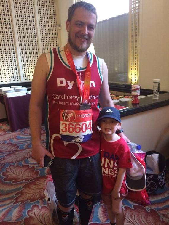 Dylan Hughes pictured with his son Harri after completing the London Marathon