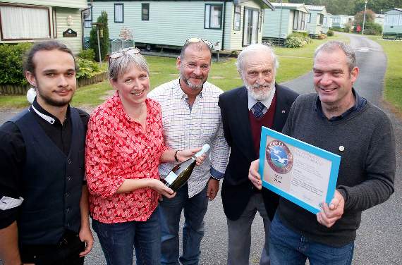 Trefor Davies (right) received an award for his exceptional service. He is pictured with Christian, Julia and Neil Warren-Kyle and Ivan Warren