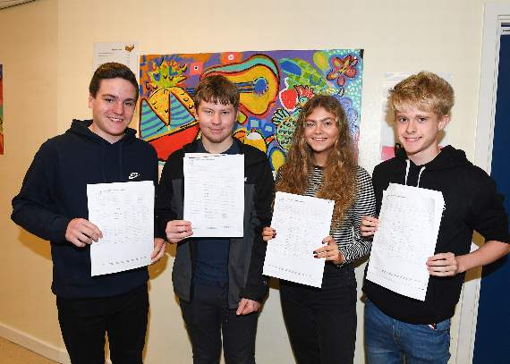 Here we have four very happy pupils from Ysgol Glan y Môr, Pwllheli – from left: Morgan Jones (4A, 6B and 2C), Elis Morgan Parry Jones (6A*, 5A and 1B), Anna Ellis Griffith (3A*, 6A and 3B) and Taliesin Griffith 3A*, 4A, 3B and 2C)