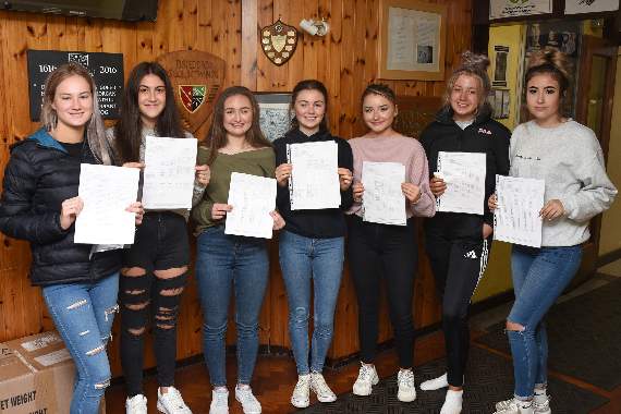 All smiles in Ysgol Botwnnog as pupils celebrated their GCSE results: Lily Badley (2A and 8B), Jasmine Edwards (1A*, 4A and 6B), Helena Griffith (1A*, 7A and 4B), Nel Williams (5A, 6B and 1C), Mirain Reader (2A*, 5A, 3B and 2C), Ffion Kelliher (2A, 4B and 4C) and Ciara Williams (1A, 7B and 3C)