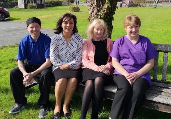 Dilys with three of her staff members: Paul Lewis, Rachael Jones and Enfys Evans