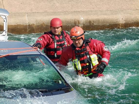 Two volunteers working through a variety of different scenarios in a variety of different water conditions