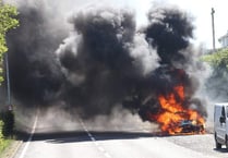 Car engulfed in flames in incident on main road