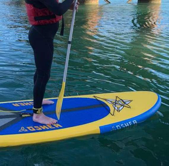 10 identical O’Shea 10’6 inflatable blue and yellow stand-up paddleboards like this one were among the equipment stolen