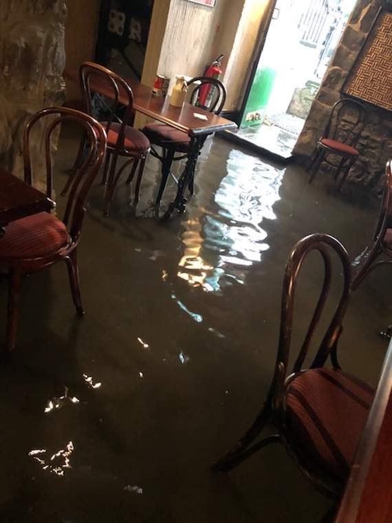 The flood has forced the restaurant owners to delay their reopening