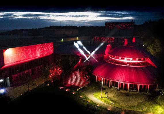 Aberystwyth Arts Centre was lit up in red last night as part of an industry-wide campaign. Photo by AMP Digital