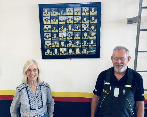 Tina Couch with RNLI’s director of lifesaving operations John Payne and the new New Quay RNLI artwork