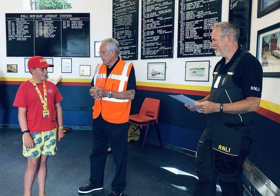 Steffan Williams being presented with a certificate for his fundraising effort