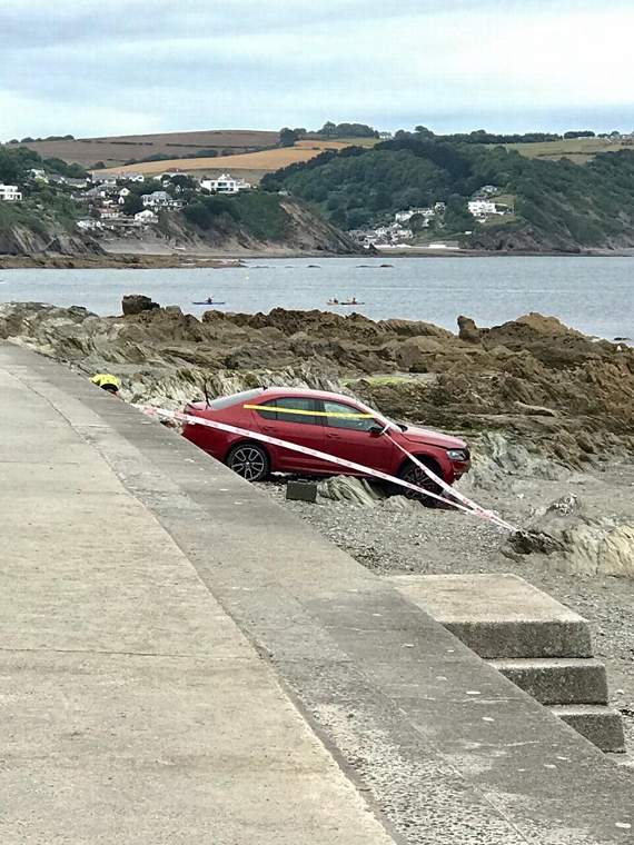 The vehicle came to rest above the high tide mark at Hannafore. Picture by Looe Coastguard