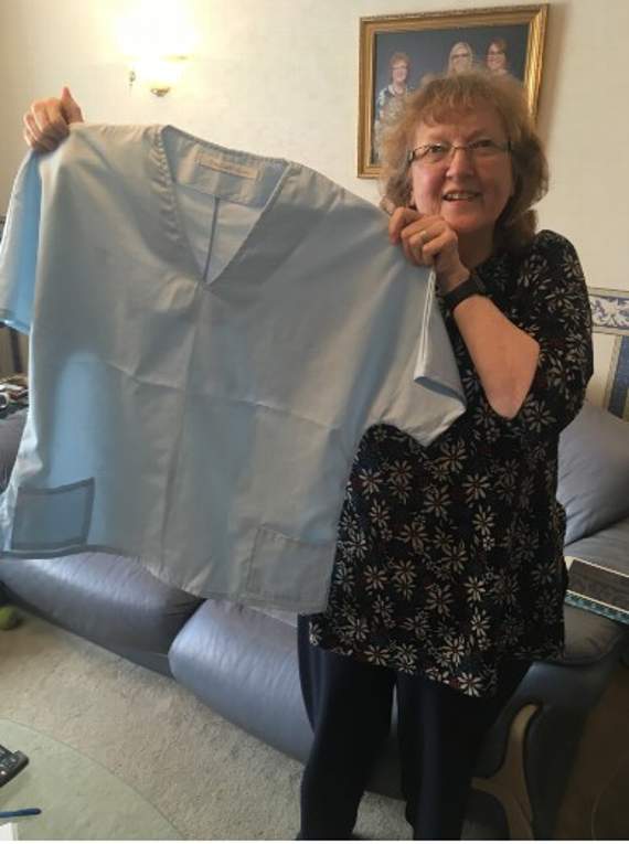 Zandra Patten of Pensilva WI with an example of the scrubs made by the group