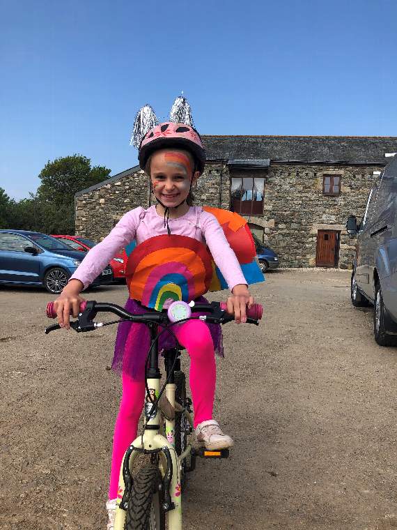 Liliana wore an array of colourful costumes to bring good cheer as she did her fundraising bike rides