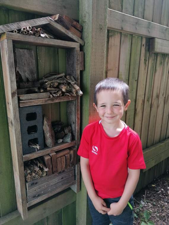 Henry with his prize-winning four-storey bug hotel
