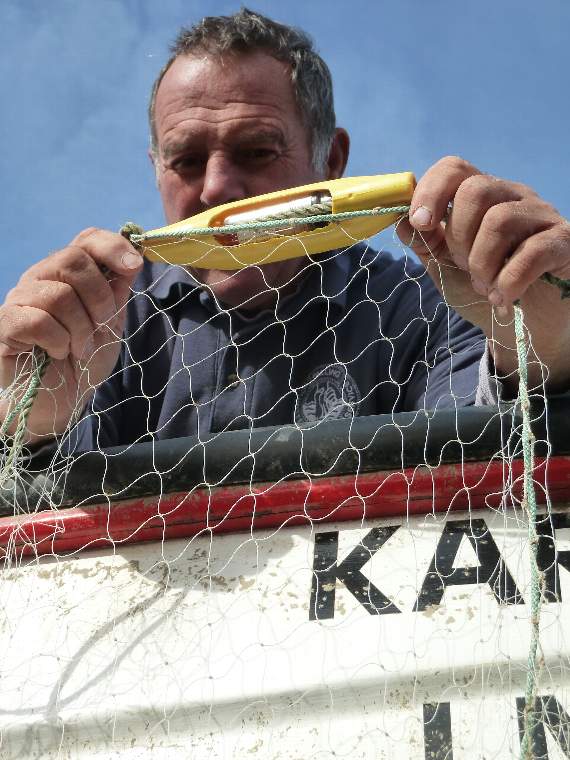 A fisherman with a 'pinger' Picture by Fishtek Marine