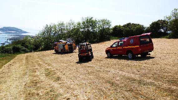 Firefighters from Looe on the Wooldown in East Looe yesterday, where they were called to put out a gorse fire. Photo by Steve Iles