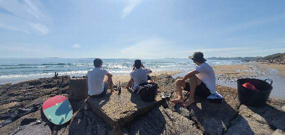 Three off-duty lifeguards keeping a voluntary lookout at Tregonhawke in Whitsand Bay. Photo by SE Cornwall Community Lifesaving Group