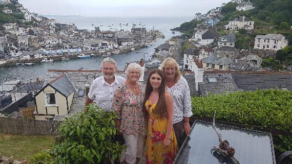 Joan and her mum Julie with their good friends Jon and Jill Friend during their visit to Looe in 2019.