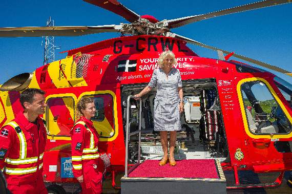 The Duchess of Cornwall tries out a seat in the new heli as she meets trainee critical care paramedics Paul Maskell and Louise Lamble