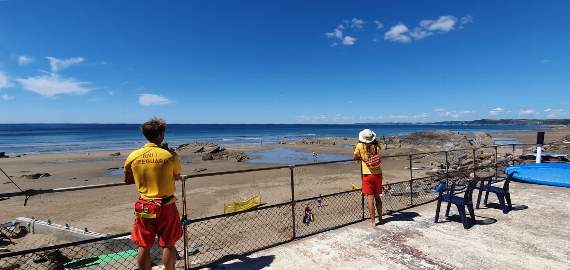 LIFEGUARDS on patrol at Tregonhawke Beach in Whitsand Bay