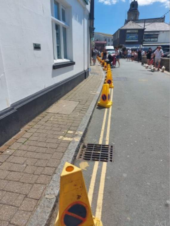 Cones marking out an area of no waiting and no unloading in East Looe. The Town Council has brought in the interventions to help reduce the number of vehicles coming into the town centre as visitor numbers increase