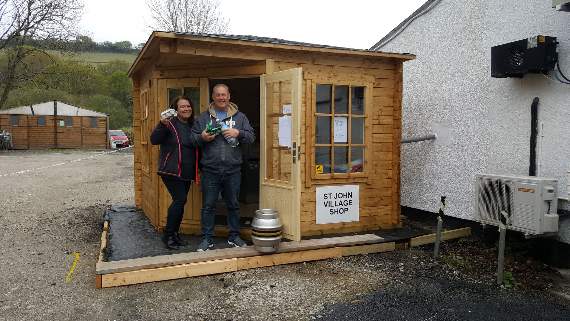 Customers stopping by at the St John Village Shop to pick up some essentials