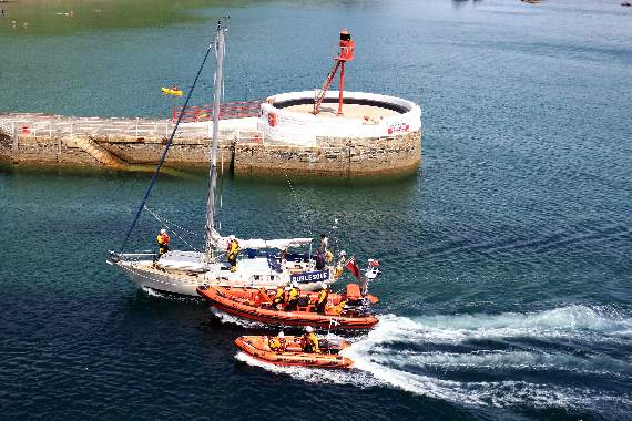The two Looe lifeboats coming into harbour with the casualty yacht