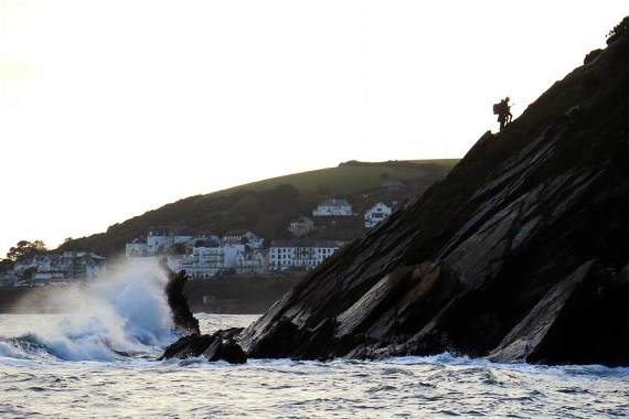 A member of the coastguard team helping one of the two people up to the top of the cliff. Photo Looe RNLI / Ian Foster