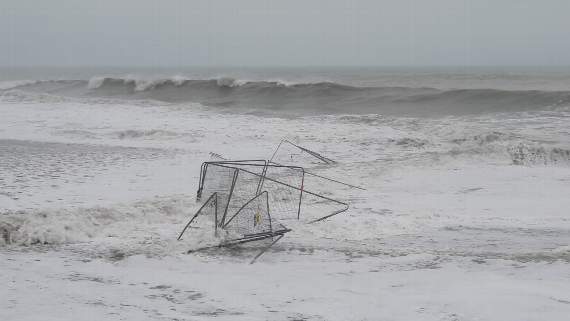 Pictures taken on Monday show how the fencing was washed into the sea by the high tide and big swell