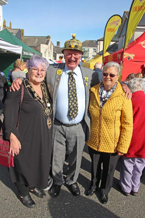 A photo from a previous honey fair with the event's modern-day founder John Trevithick and portreeve Suzan Tolman