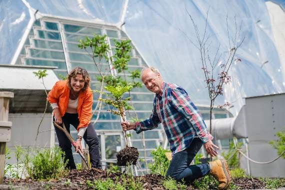 Environment minister Rebecca Pow plants a tree at the Eden Project with founder Tim Smit