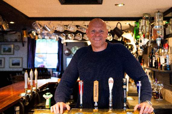 Tom behind the bar of the White Hart in Chilsworthy