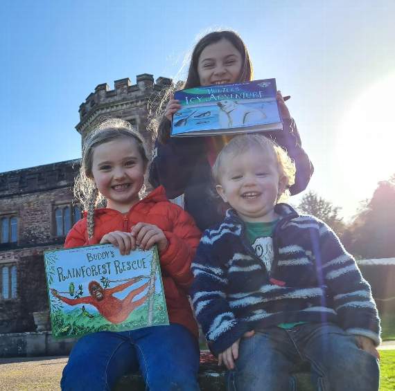 Jasmine Church, 9, Rosie Church, 6, and Isaac Perry, 2, enjoying the new books at Mount Edgcumbe, where Helen Lester-Hinchcliff at the Upcycled Home Co is one of the businesses that has backed the crowdfunding appeal. “Learning to care for our environment at a young age is such an important message to be teaching our children,” said Helen.