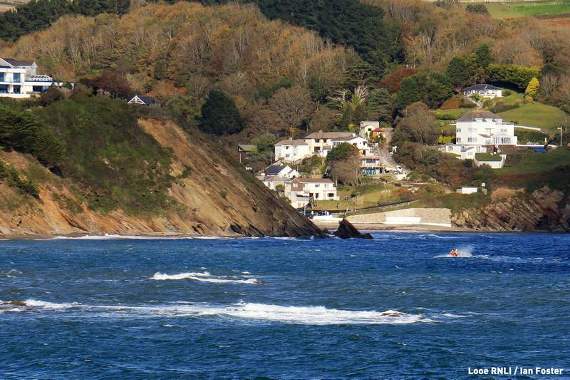 Looe's inshore lifeboat and crew approaching the rocks near Millendreath where the two people were stuck. Photo Looe RNLI / Ian Foster
