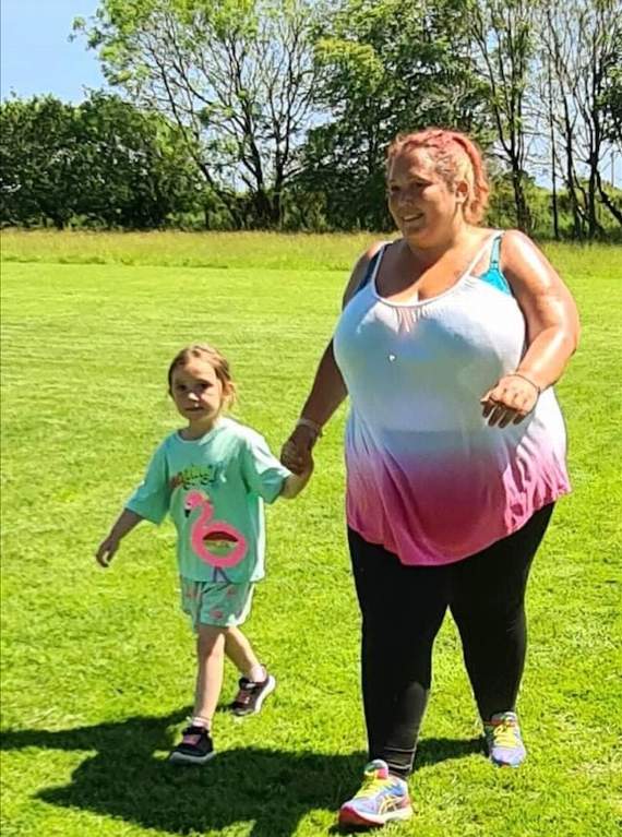 Kora and mum Xana Bradley doing a lap of the field
