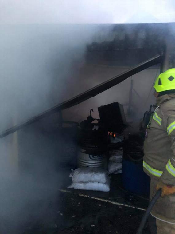 A large LPG cylinder was involved in the fire, which had spread to the shed/garage. Photo: Saltash Community Fire Station