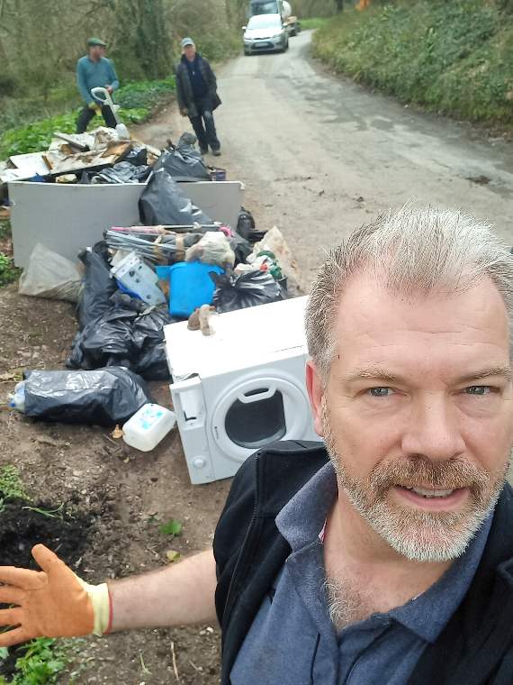 Tamar Valley AONB Manager Dan Cooke and two volunteer helperswith the estimated two tonnes of fly-tipped items cleared up at Wacker Quay