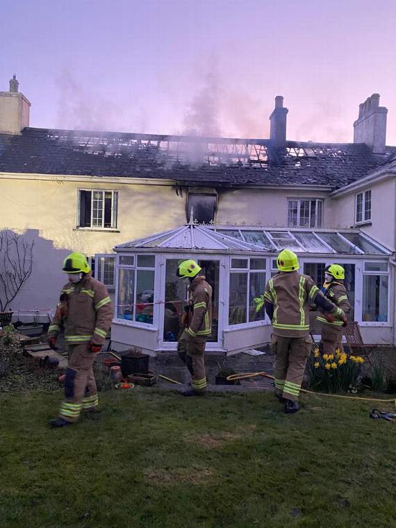 The scene this morning as two crews remained at the property to monitor the aftermath of the fire