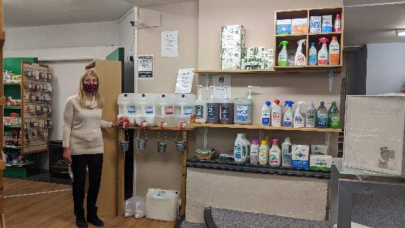 Staff member Angie Bent at the refill station. Health and Happiness offers refills on products such as shampoo and handwash, laundry liquid and fabric conditioner