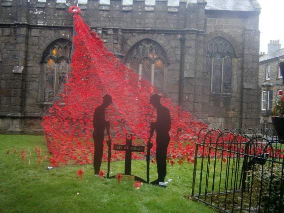 The Poppy Wave and soldier silhouettes outside St Mary's Church.