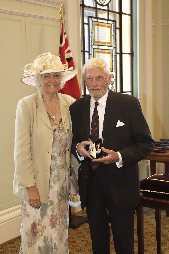 COLIN and Carole Brown photographed at Trinity House, with Colin proudly holding his medal in its presentation box