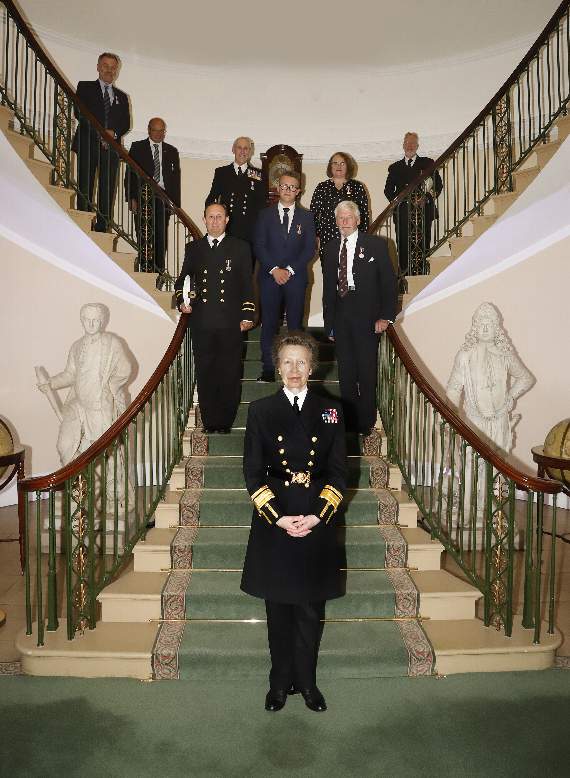 HRH Princess Anne with medal recipients including Colin Brown on the staircase at Trinity House