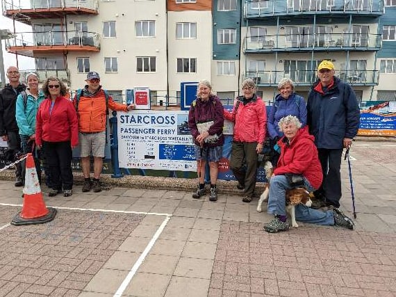 The group on arrival in Exmouth at the ferry crossing to Starcross. Pictured (left of sign) Andrew, Tamsin, Anne, and Tim and (right) Linda, Dot, Sue, Sabby (with Topsy) and Alan.